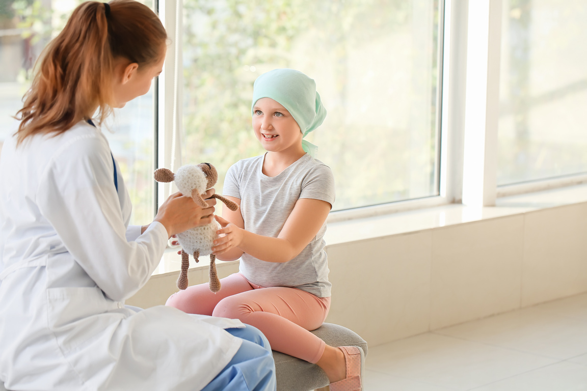 Doctor and Little Girl in Clinic. Childhood Cancer Awareness Concept